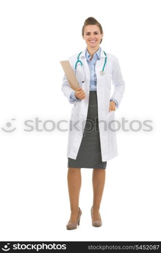 Full length portrait of medical doctor woman with clipboard