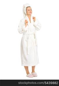 Full length portrait of relaxed young woman in bathrobe