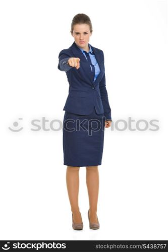 Full length portrait of serious business woman pointing in camera