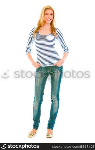 Full length portrait of smiling beautiful teen girl with hands in pockets of jeans isolated on white&#xA;