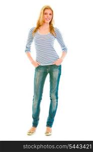 Full length portrait of smiling beautiful teen girl with hands in pockets of jeans isolated on white&#xA;