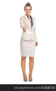 Full length portrait of smiling business woman giving business card