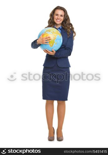 Full length portrait of smiling business woman hugging globe