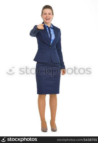 Full length portrait of smiling business woman pointing in camera