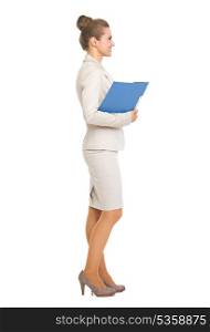 Full length portrait of smiling business woman with folder