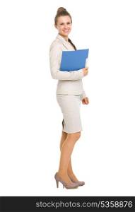 Full length portrait of smiling business woman with folder