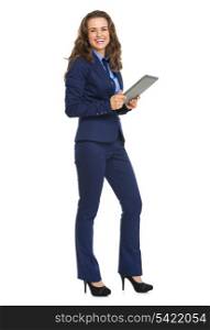 Full length portrait of smiling business woman with tablet pc