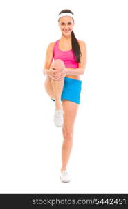 Full length portrait of smiling fitness woman doing stretching exercise isolated on white&#xA;