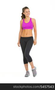 Full length portrait of smiling fitness young woman looking on copy space