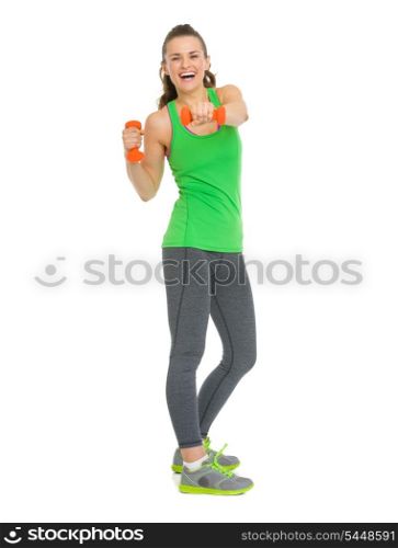 Full length portrait of smiling fitness young woman making exercise with dumbbells