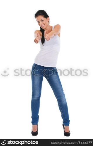 Full length portrait of smiling girl showing thumbs up