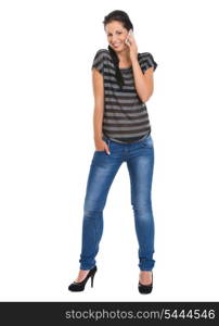 Full length portrait of smiling girl speaking mobile phone