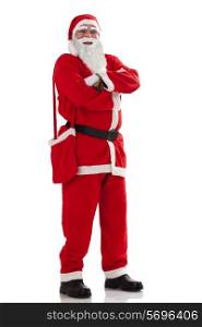 Full length portrait of smiling Santa Claus with arms folded standing over white background