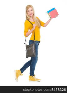 Full length portrait of smiling student girl going sideways