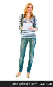 Full length portrait of smiling teengirl with schoolbag writing in notebook isolated on white &#xA;
