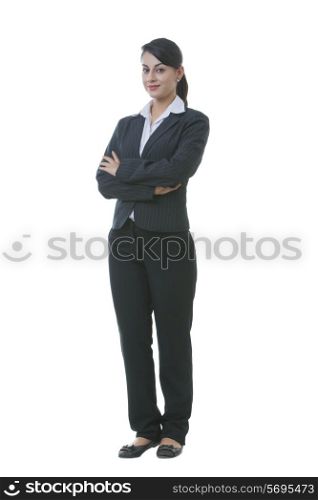 Full length portrait of well-dressed businesswoman against white background