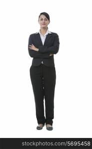 Full length portrait of well-dressed Indian businesswoman standing against white background