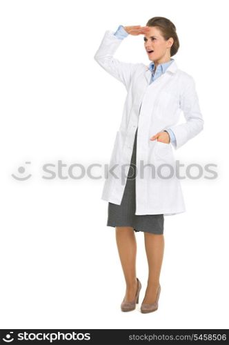 Full length portrait of woman in white robe looking on copy space