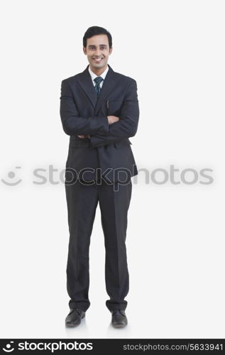 Full length portrait of young businessman isolated over gray background