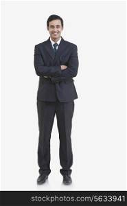 Full length portrait of young businessman isolated over gray background