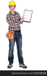 full-length portrait of young craftsman holding clipboard