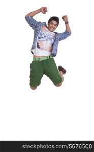 Full length portrait of young man cheering and jumping over white background