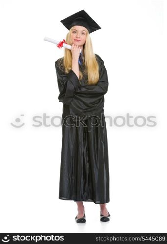 Full length portrait of young woman in graduation gown with diploma