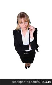 Full length shot of a blonde woman wearing a headset