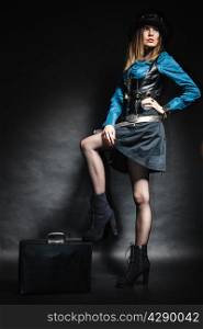 Full length steampunk retro woman with bag suitcase studio shot grunge dark background