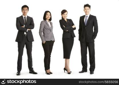 Full Length Studio Portrait Of Chinese Business Team