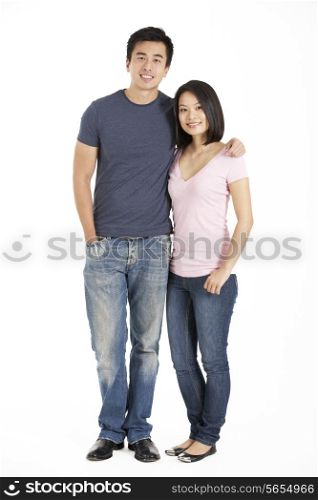 Full Length Studio Shot Of Chinese Couple