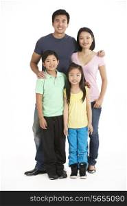 Full Length Studio Shot Of Chinese Family
