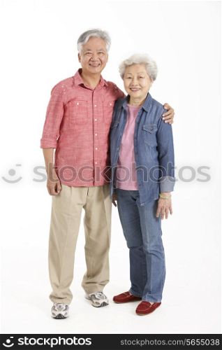 Full Length Studio Shot Of Chinese Senior Couple