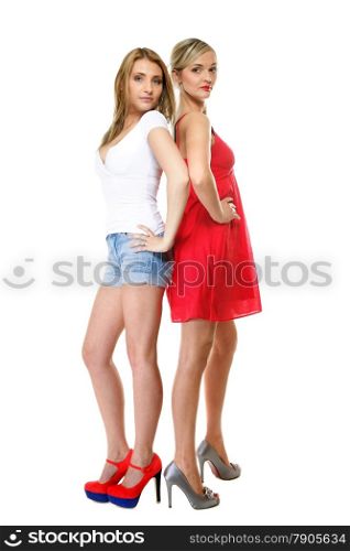 Full length two beautiful sexy crazy women in summer clothes. Studio portrait isolated on white background.