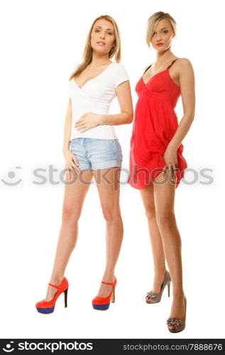 Full length two beautiful sexy fashion women in summer clothes. Studio portrait isolated on white.