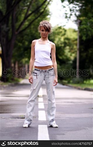 Full length, walking woman in blue jeans