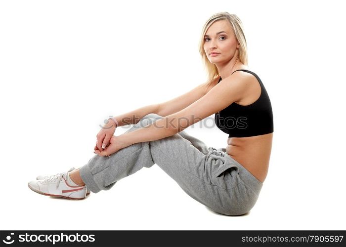 Full length young sporty woman after intense workout, isolated on white background.
