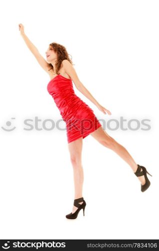 Full length young woman teen girl in elegant red dress raise her hand up holding imaginary invisible balloons and flying isolated on white background