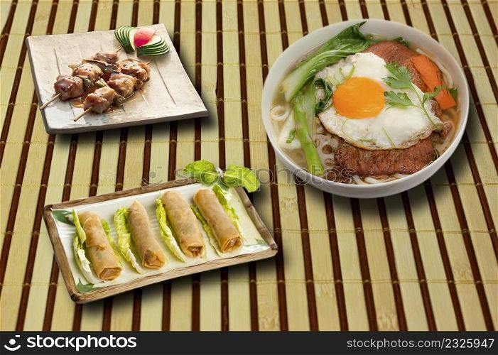 full menu of asian food on bamboo tablecloth