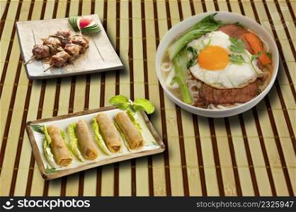 full menu of asian food on bamboo tablecloth