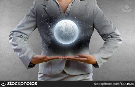 Full moon. Close up of businesswoman holding in hands full moon