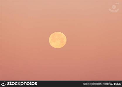 Full moon in the clear evening sky