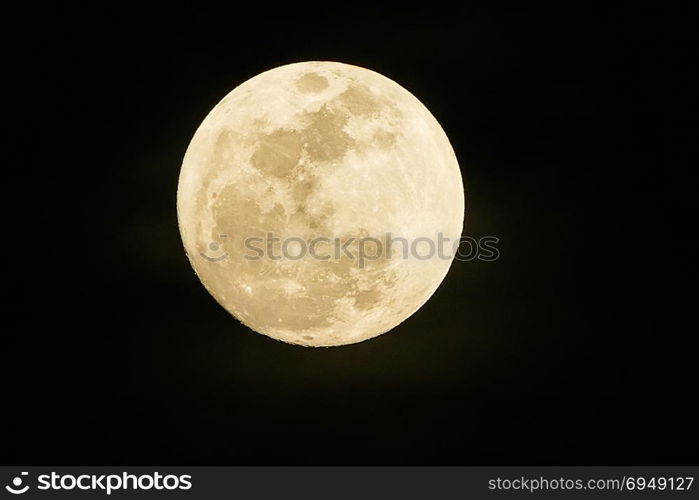 Full moon on dark black sky at night