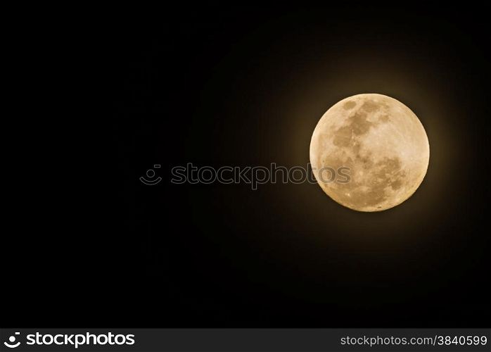 Full moon on dark sky before lunar eclipse night