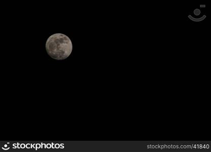Full moon over dark black sky on night, Selective focus