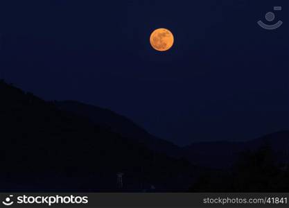 Full moon over dark black sky on night, Selective focus