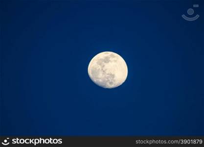 Full moon over dark sky at night