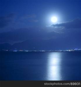 Full moon over sea and moon-glade, Crete Island, Greece