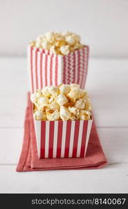 Full of tasty caramel popcorn in classic striped box. 