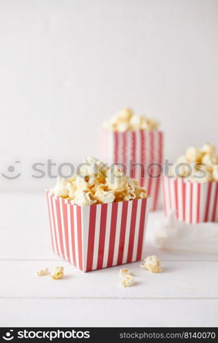 Full of tasty caramel popcorn in classic striped box. 